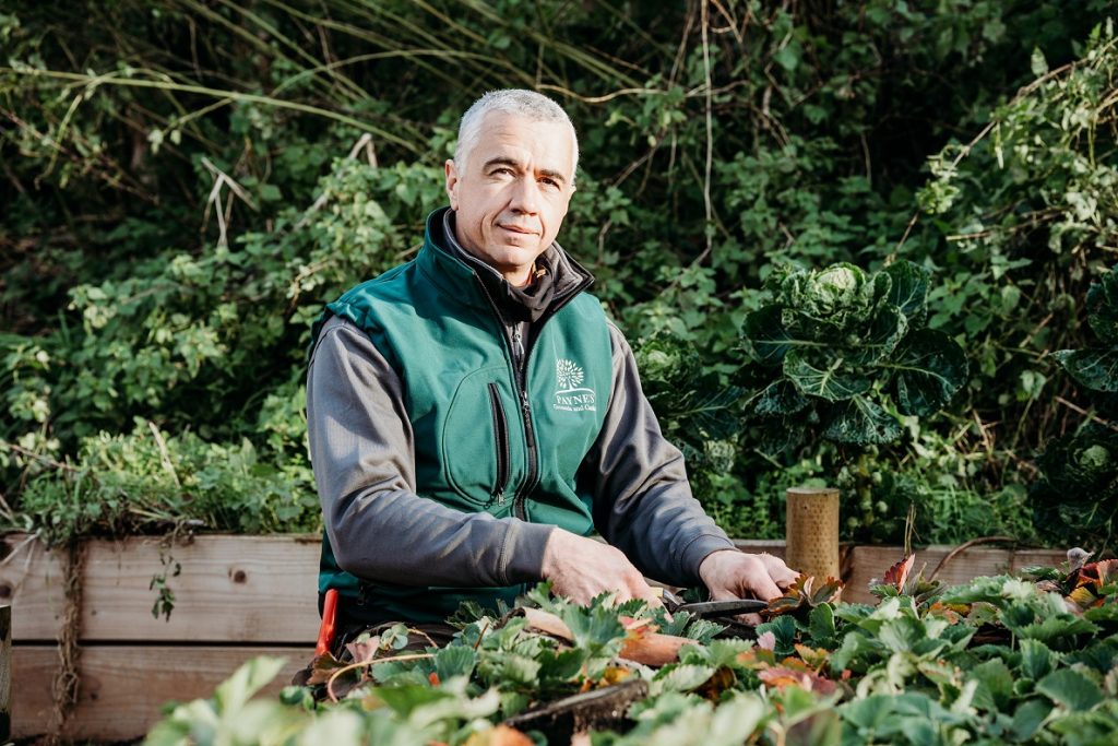 Confident gardener in a garden