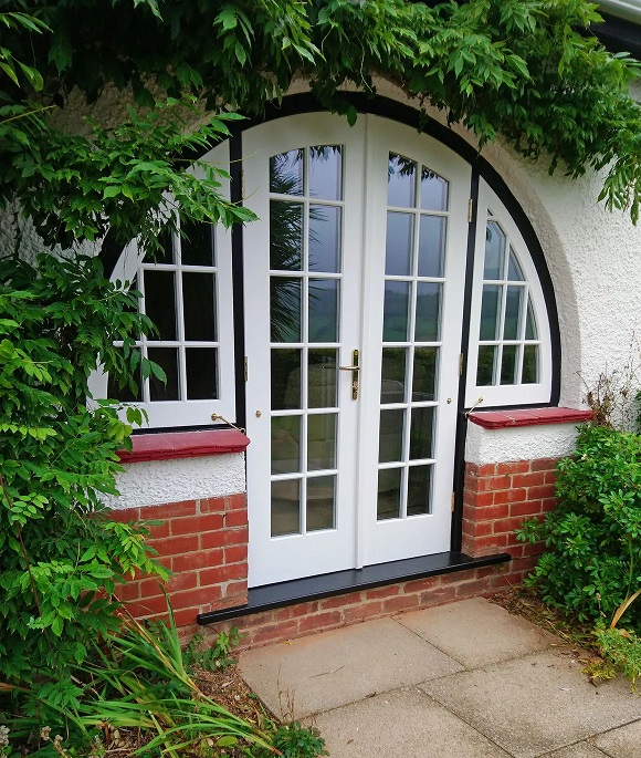 Arched enreance doorway with side windows