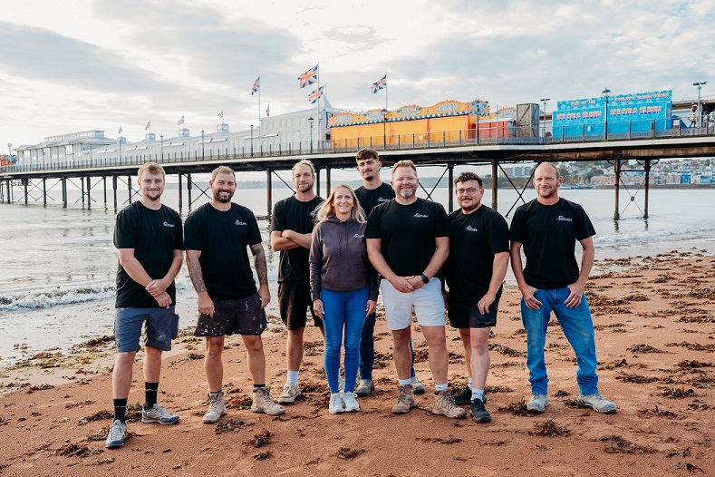 Team of friendly builders on Paignton beach