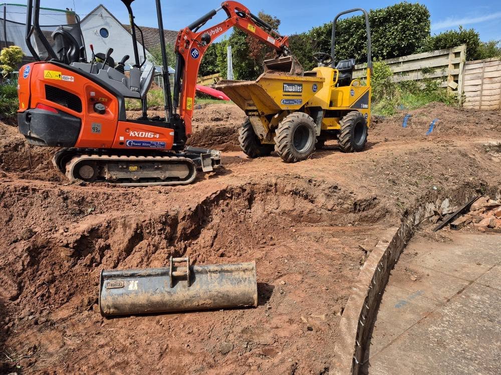 Mini digger and tipper in domestic garden - for considerable domestic groundworks
