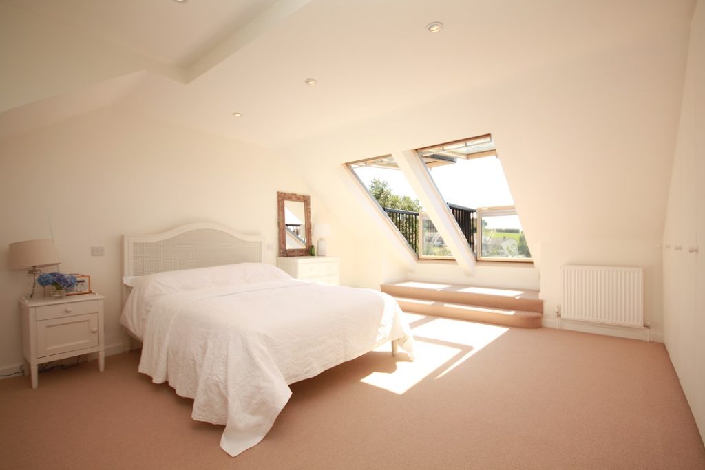 Beautiful loft bedroom with velux windows