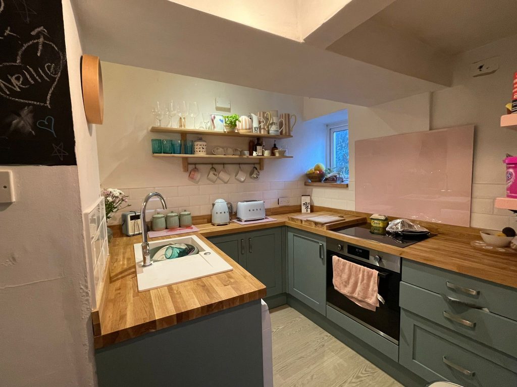 Beautiful modern kitchen installation with wooden worktops