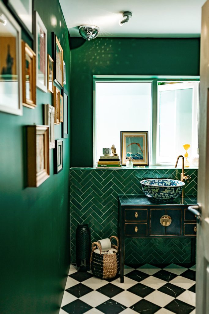 Bathroom designed with strong bold teal colours and Moroccan sink bowl.